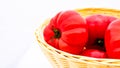 Fresh and tasty red tomatoes in wicker basket isolated Royalty Free Stock Photo