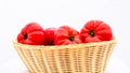 Fresh and tasty red tomatoes in wicker basket isolated Royalty Free Stock Photo