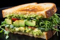 fresh tasty sandwich Baguette sandwich Fresh ham sandwich with lettuce, slices of fresh tomatoes Royalty Free Stock Photo