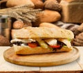 Fresh tasty sandwich on cutting board Royalty Free Stock Photo