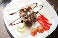 Fresh tasty shashlik with vegetables on the plate. Royalty Free Stock Photo