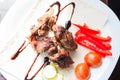 Fresh tasty shashlik with vegetables on the plate. Royalty Free Stock Photo