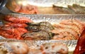 Fresh tasty shrimps on a plate fish shop market counter