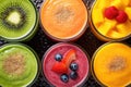 fresh tasty smoothies with different fruits Royalty Free Stock Photo