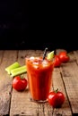 Fresh Tasty Tomato Celery Juice in Glass Fresh Tomatoes and Green Celery on Old Wooden Background Healthy Detox Drink Vertical Royalty Free Stock Photo