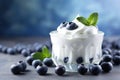 fresh tasty yogurt in glass with blueberry