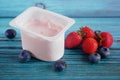 Fresh tasty yogurt and strawberries and blueberries on wooden background. Healthy Breakfast Concept Royalty Free Stock Photo