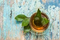 Fresh tea from bay leaf in a cup on a wooden rustic table Royalty Free Stock Photo