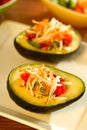 Fresh Thai Papaya salad in a avocado