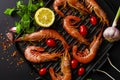 Fresh Tiger prawns on iron grill pan and ingredients