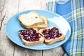 Fresh toasted cereal bread slices with homemade wild berries jam and linen napkin. Royalty Free Stock Photo