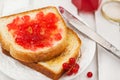 Fresh toasts with jelly, cup of coffee and fruits for breakfast Royalty Free Stock Photo