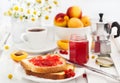 Fresh toasts with jelly, cup of coffee and fruits for breakfast Royalty Free Stock Photo