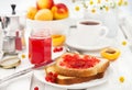 Fresh toasts with jelly, cup of coffee and fruits for breakfast Royalty Free Stock Photo