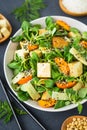 Fresh tofu salad with sesame seeds, corn salad, apricote and bamboo Royalty Free Stock Photo