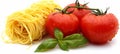 Fresh tomato and basil garnish on single serving of spaghetti against white background Royalty Free Stock Photo