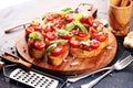 Fresh tomato bruschetta. italian food appetizer with basil on table