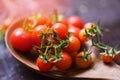 Fresh tomato cherry organic / Close up ripe red tomatoes wooden spoon background Royalty Free Stock Photo