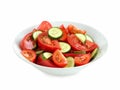 fresh tomato and cucumber salad salad in a white bowl, isolated on white Royalty Free Stock Photo