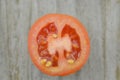 Fresh Tomato cut half on wooden background, decorate Royalty Free Stock Photo