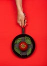 Fresh tomato on frying pan with basilic. Royalty Free Stock Photo