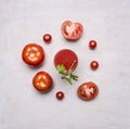 Fresh tomato juice in a glass with a straw, with green leaf, chopped tomatoes spread around wooden rustic background top view c Royalty Free Stock Photo