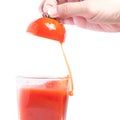 Fresh tomato juice pouring into glass Royalty Free Stock Photo
