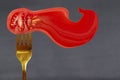 Fresh tomato slice on a fork Royalty Free Stock Photo
