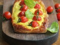 Fresh tomato tart, puff pastry topped with ricotta, cheese and cherry tomatoes Royalty Free Stock Photo