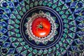 fresh tomato on traditional oriental ceramic plate Royalty Free Stock Photo