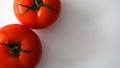 Fresh tomato on white