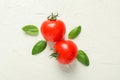 Fresh tomatoes and basil on white background, space for text and closeup Royalty Free Stock Photo