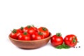 Fresh tomatoes in a bowl with basil isolated Royalty Free Stock Photo
