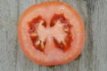 Fresh Tomatoes cut half on wooden background, decorate Royalty Free Stock Photo