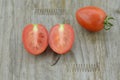 Fresh Tomatoes cut half on wooden background, decorate Royalty Free Stock Photo