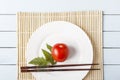 Fresh tomatoes with food sticks on bamboo mat. Natural food for healthy an dietary breakfast or dinner. Top view with copy space Royalty Free Stock Photo