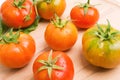 Fresh Tomatoes On Wooden Plate Royalty Free Stock Photo