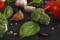 Fresh tomatoes and garlic closeup on dark rustic wood Royalty Free Stock Photo