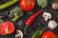 Fresh tomatoes and garlic closeup on dark rustic wood Royalty Free Stock Photo