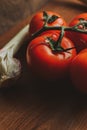 Fresh tomatoes and garlic. Rustic concept Royalty Free Stock Photo