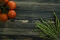 Fresh tomatoes on rosemary branch Royalty Free Stock Photo