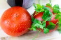 Fresh tomatoes with waterdrops and parsley Royalty Free Stock Photo