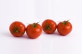 Fresh tomatoes on white background. Four red ripe tomatoes isolated on white background. Tomatoes on white background. Royalty Free Stock Photo