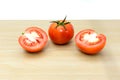 Fresh tomatoes on wooden background.