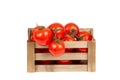 Fresh tomatoes in a wooden crate isolate on a white background Royalty Free Stock Photo