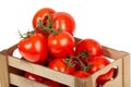 Fresh tomatoes in a wooden crate isolate on a white background Royalty Free Stock Photo