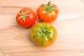 Fresh Tomatoes On Wooden Plate Royalty Free Stock Photo