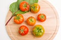 Fresh Tomatoes On Wooden Plate Royalty Free Stock Photo