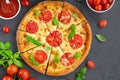 Fresh traditional Italian pizza Margarita or margharita with tomato sauce, mozzarella cheese and fresh green basil on top Royalty Free Stock Photo