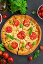 Fresh traditional Italian pizza Margarita or margharita with tomato sauce, mozzarella cheese and fresh green basil on top Royalty Free Stock Photo
